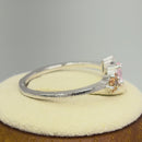 Sterling Silver Round Pear and Tapered Baguette Pink and Champagne CZ Ring
