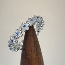 Sterling Silver Plumeria Blue Spinel CZ Eternity Band Ring