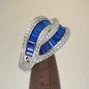 Sterling Silver Emerald Cut Blue Spinel Looping Band Ring