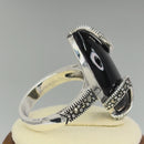 Sterling Silver Black Onyx Oval Wrap Marcasite Ring