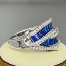 Sterling Silver Emerald Cut Blue Spinel Looping Band Ring